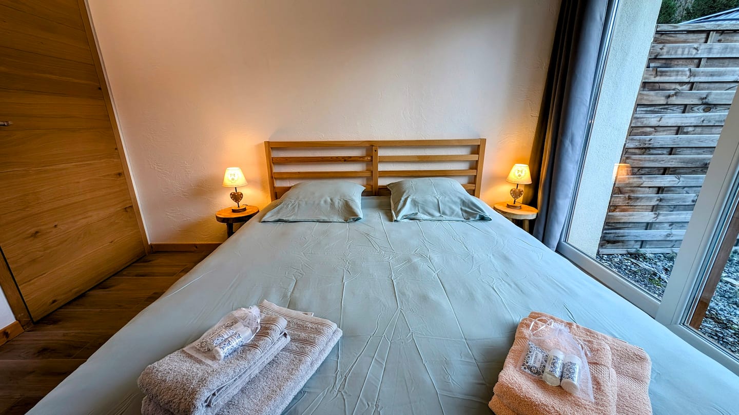 Double bedroom with garden door and built-in storage