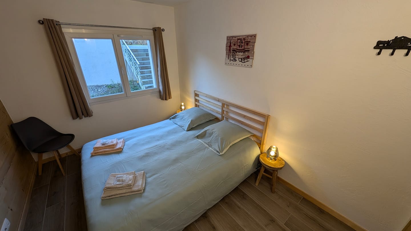 Double bedroom with window and wardrobe