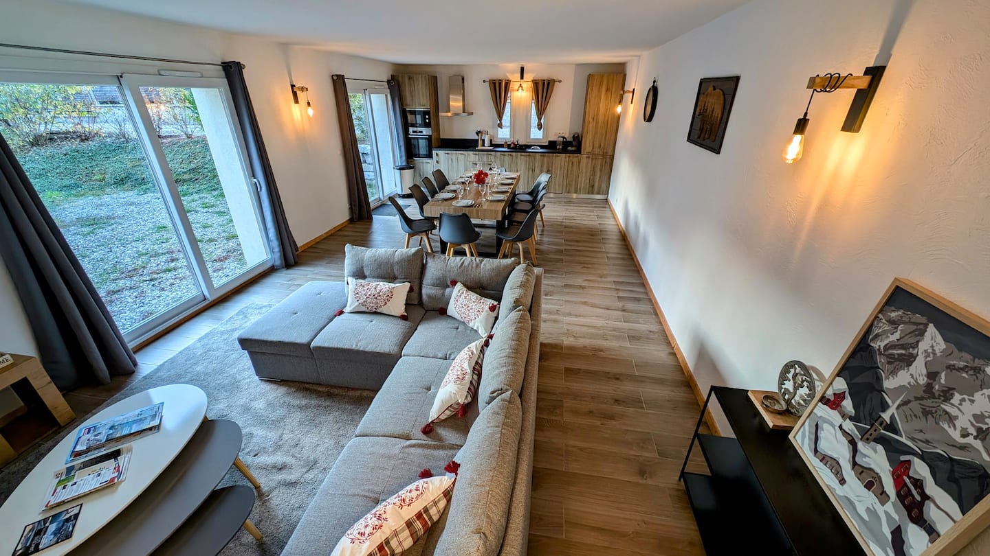 Full view through the living room towards the dining table and kitchen